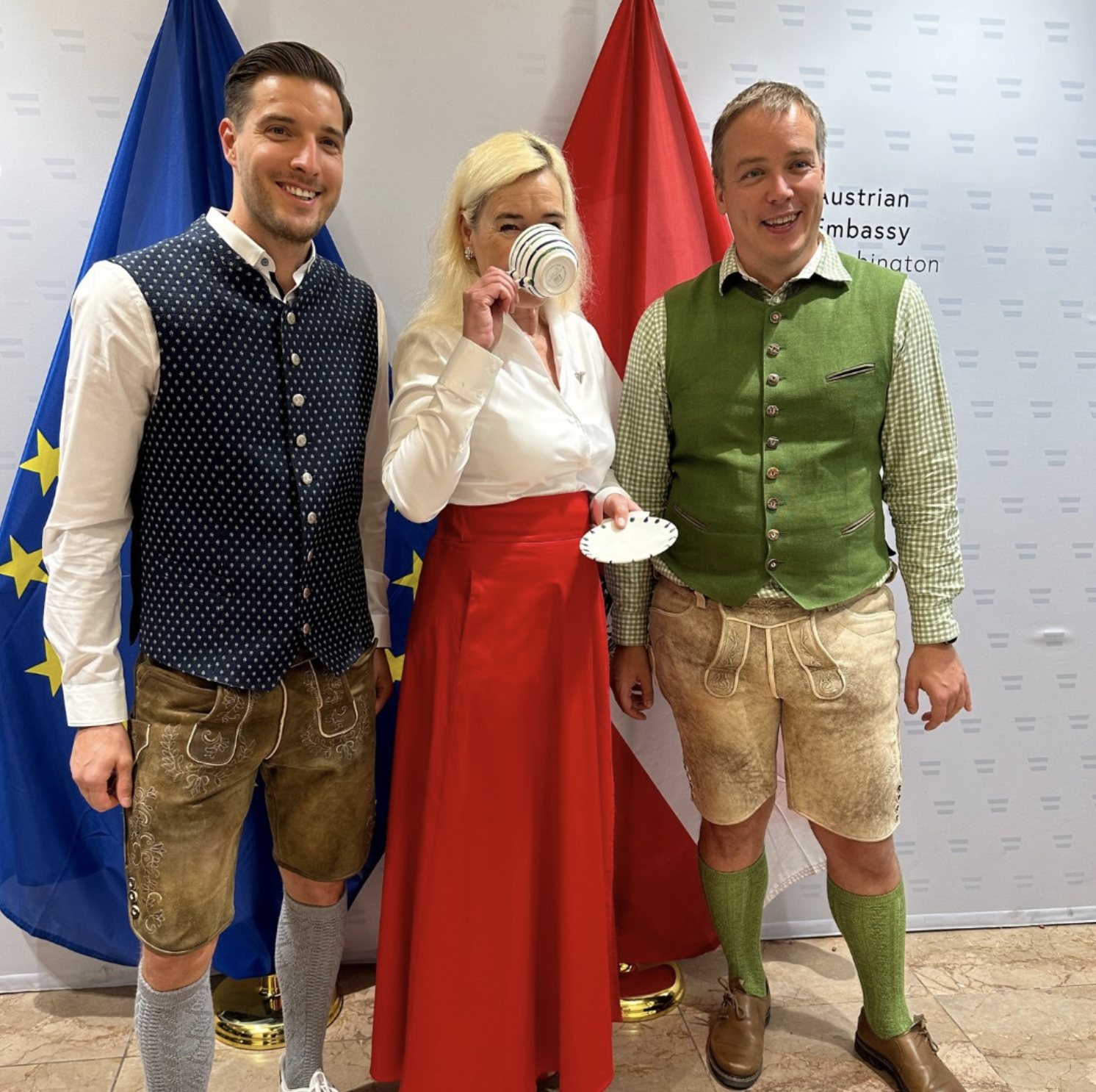 Austrian Ambassador Petra Schneebauer sips from the Gmundner Keramik set given out to attendees of the Austrian National Day October 25 at the embassy. Photo courtesy of the Embassy of Austria.